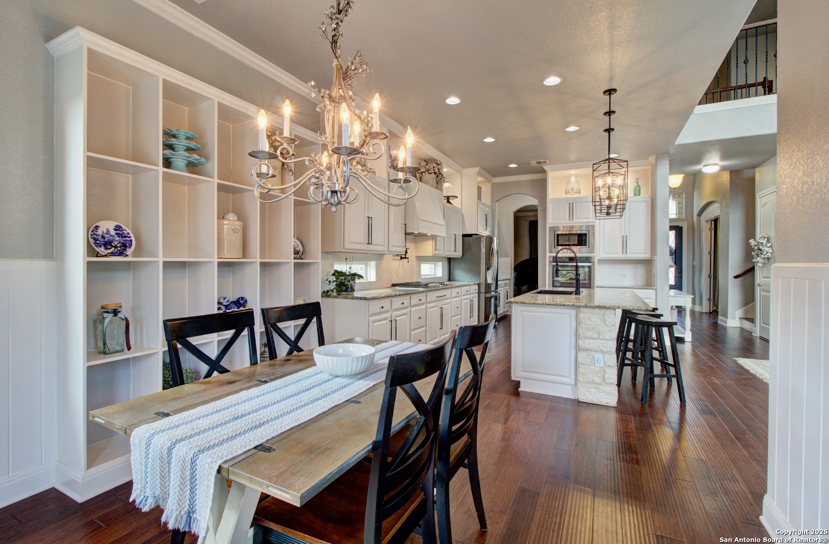 28518 Tristant Ridge San Antonio, TX 78260 - Photo 16 of 43 a view of a dining room with furniture and wooden floor