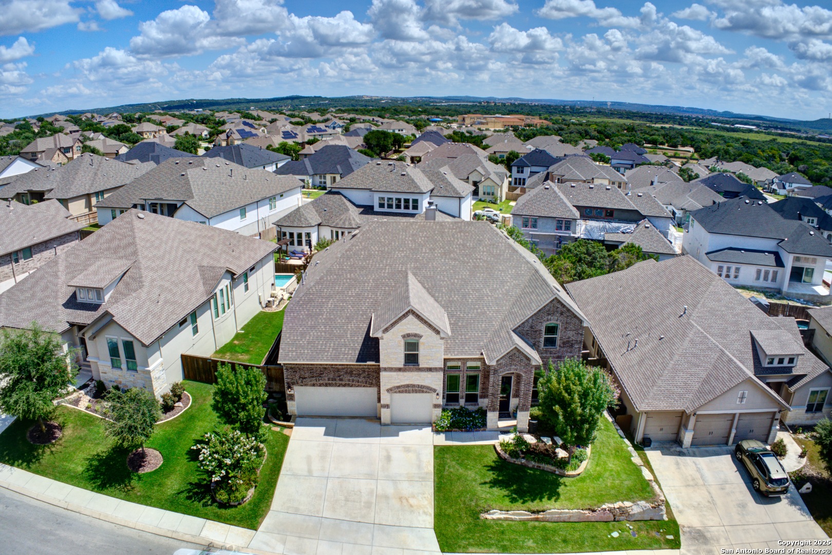 28518 Tristant Ridge San Antonio, TX 78260 - Photo 3 of 43 an aerial view of multiple houses with a yard