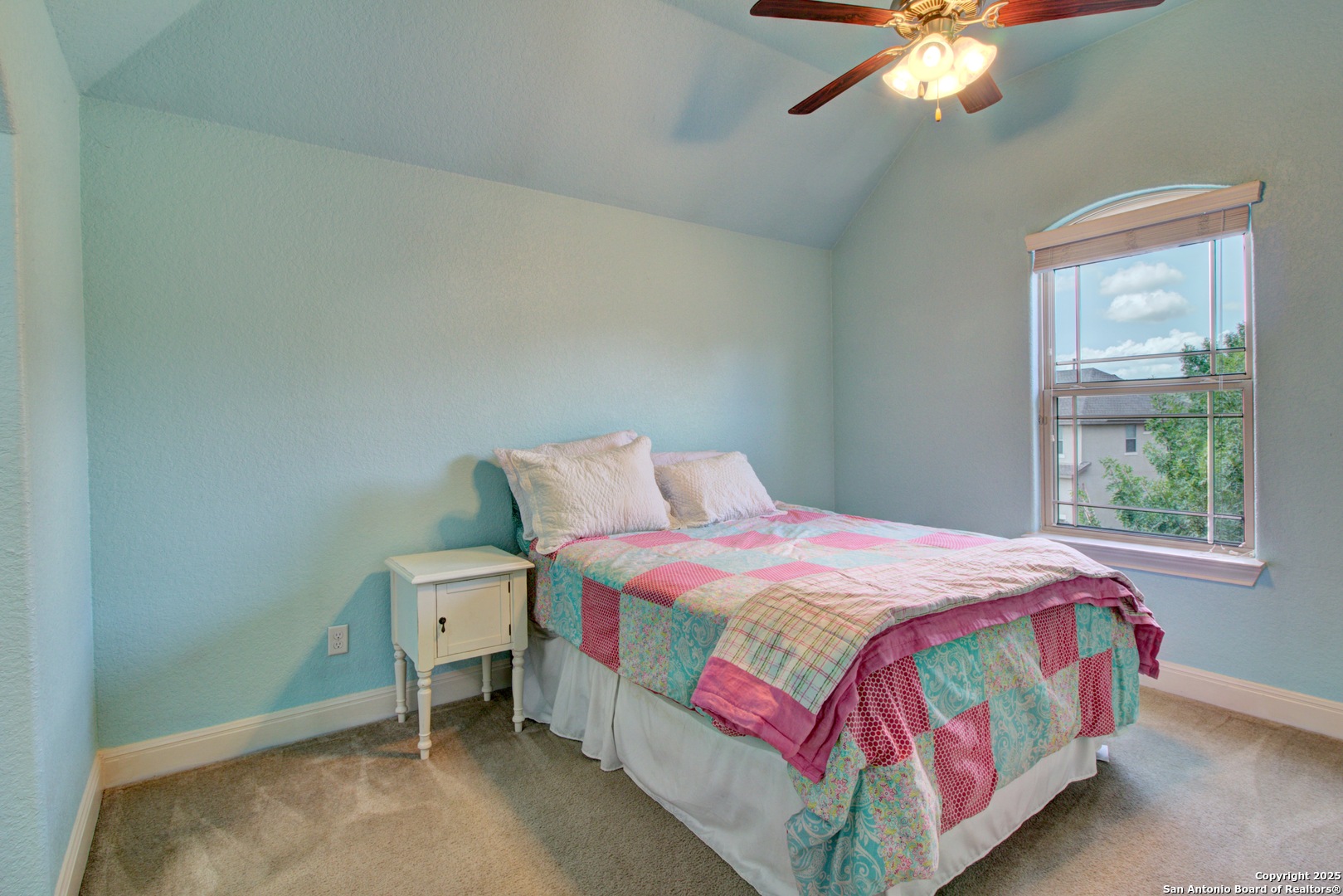 28518 Tristant Ridge San Antonio, TX 78260 - Photo 33 of 43 a bedroom with a bed and a chandelier