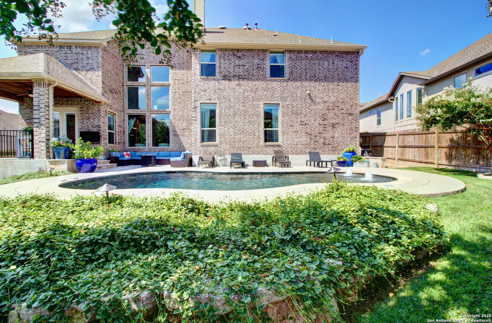 28518 Tristant Ridge San Antonio, TX 78260 - Photo 36 of 43 a view of a house with a swimming pool and a yard