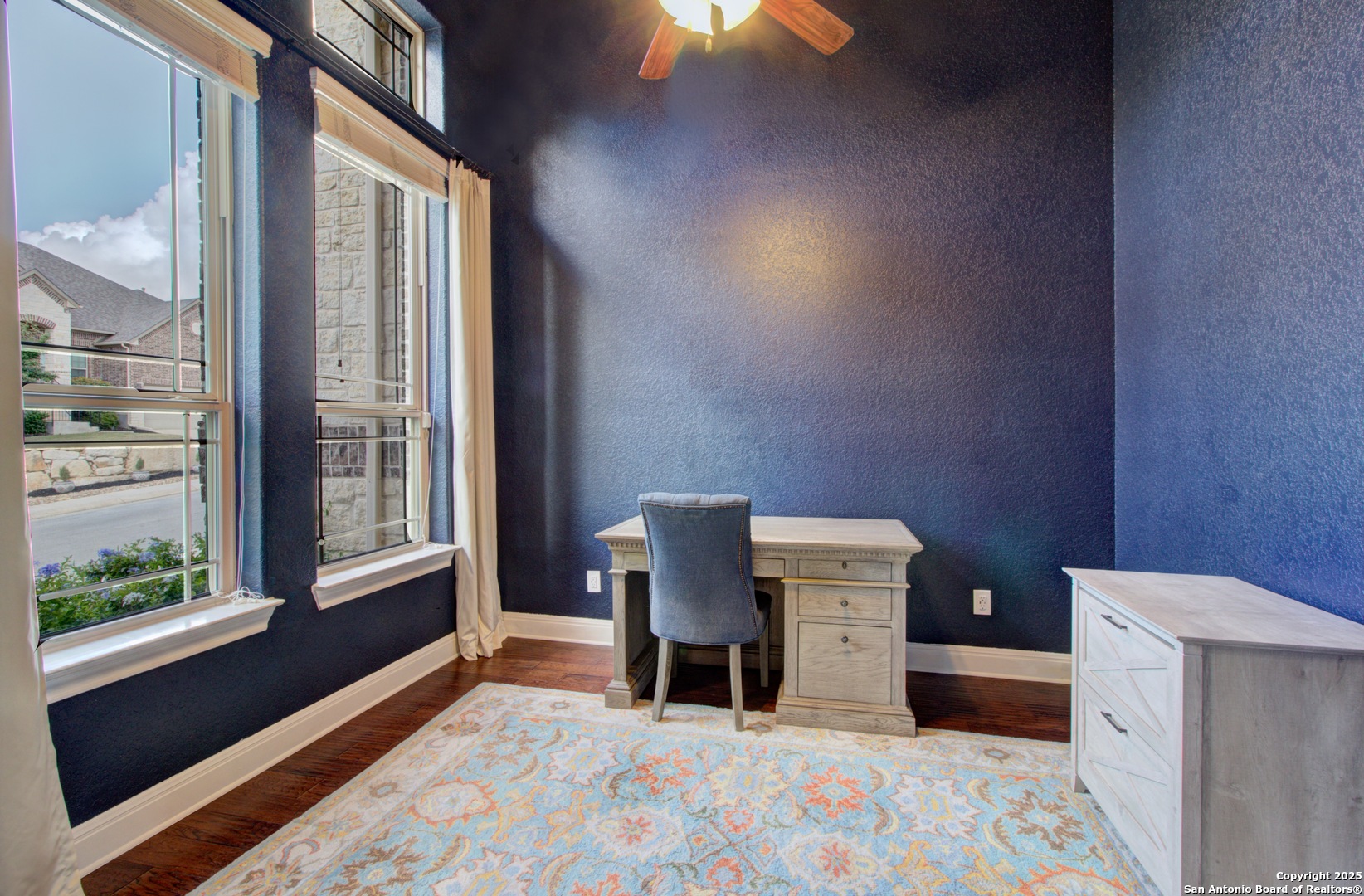 28518 Tristant Ridge San Antonio, TX 78260 - Photo 8 of 43 a bedroom with a bed and large window with outer view