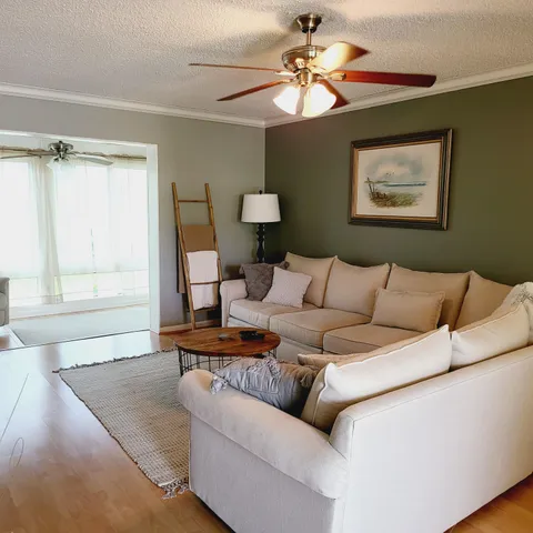 a living room with furniture and a window