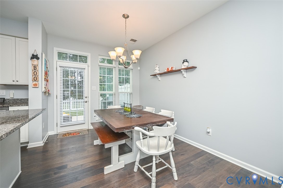 8990 Ringview Drive Mechanicsville, VA 23116 - Photo 11 of 39 Dining space featuring a chandelier and engineered