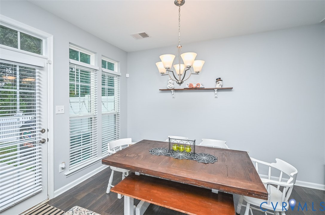 8990 Ringview Drive Mechanicsville, VA 23116 - Photo 12 of 39 Dining space featuring a chandelier and engineered