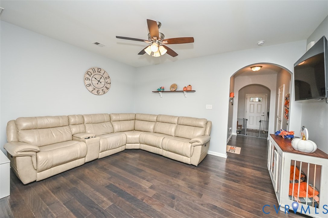 8990 Ringview Drive Mechanicsville, VA 23116 - Photo 13 of 39 Living area with arched walkway, engineered hardwo