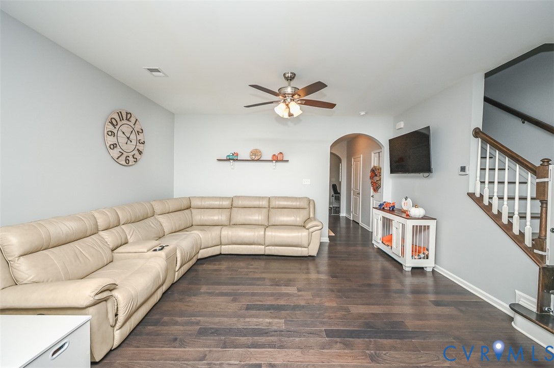 8990 Ringview Drive Mechanicsville, VA 23116 - Photo 14 of 39 Living area with arched walkway, engineered hardwo