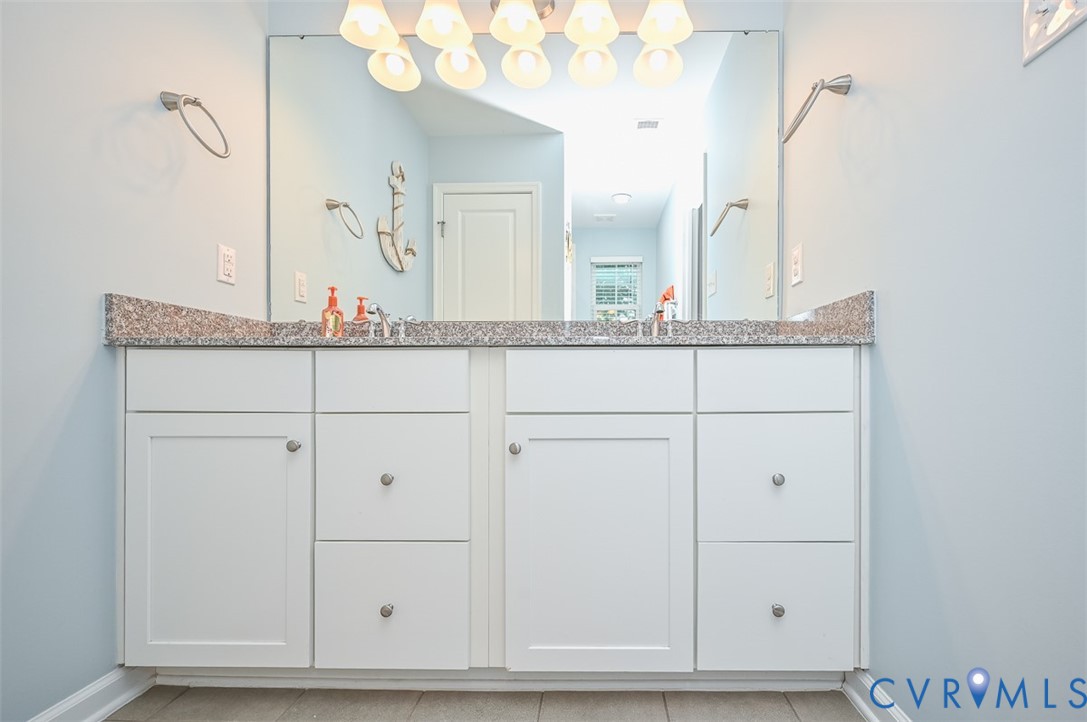 8990 Ringview Drive Mechanicsville, VA 23116 - Photo 25 of 39 Bathroom with double vanity and light tile floors