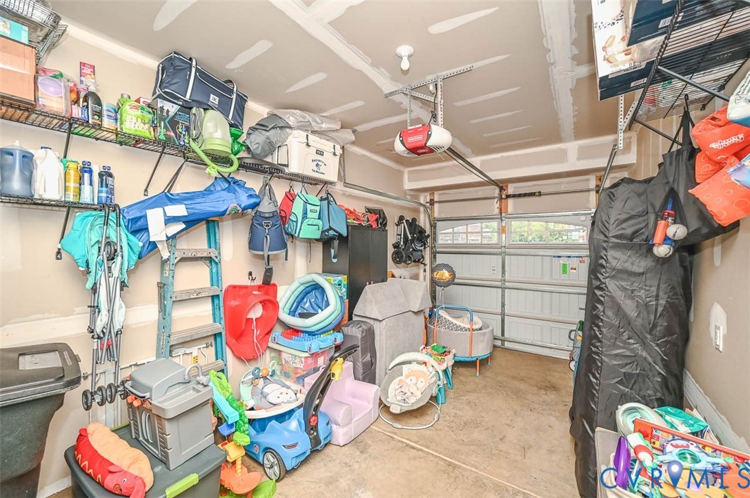 8990 Ringview Drive Mechanicsville, VA 23116 - Photo 38 of 39 Garage featuring a garage door opener