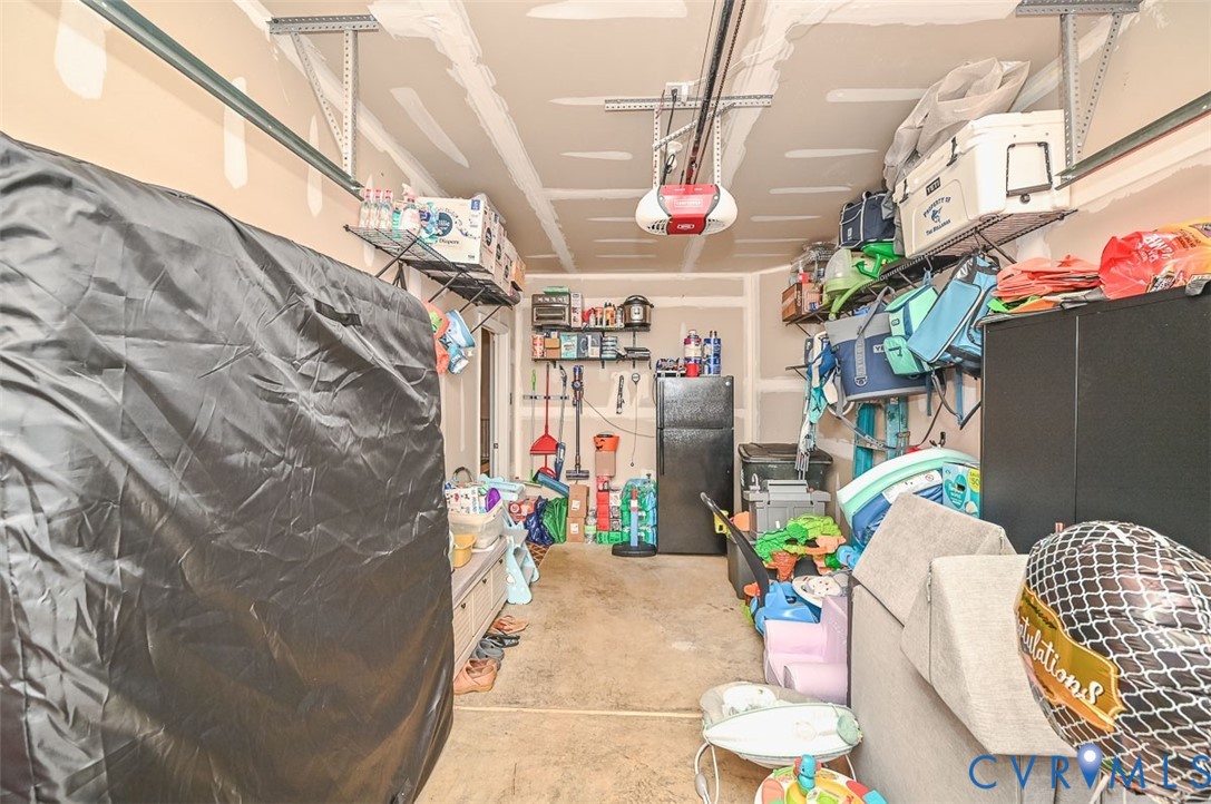 8990 Ringview Drive Mechanicsville, VA 23116 - Photo 39 of 39 Garage featuring a garage door opener