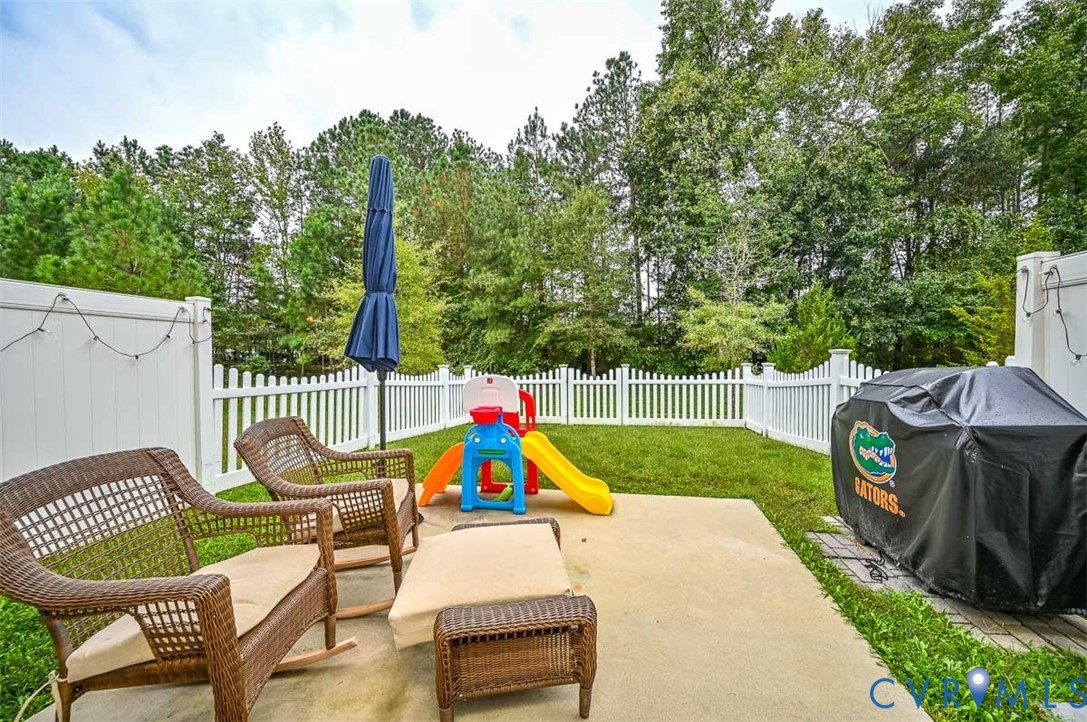 8990 Ringview Drive Mechanicsville, VA 23116 - Photo 6 of 39 Fenced backyard with grilling area, a patio area,