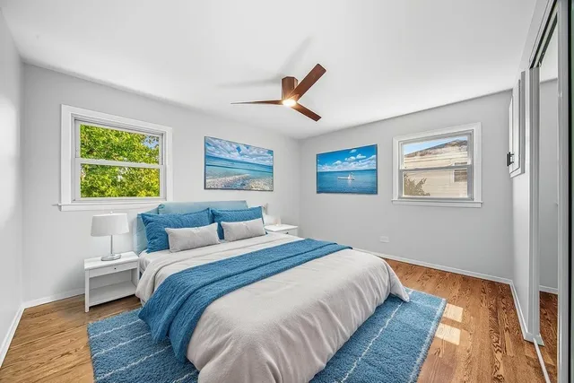 a bedroom with bed and a window