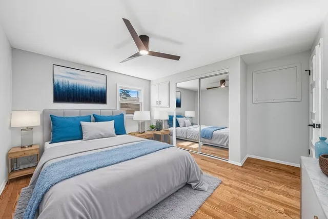 a bedroom with a large bed and a couch