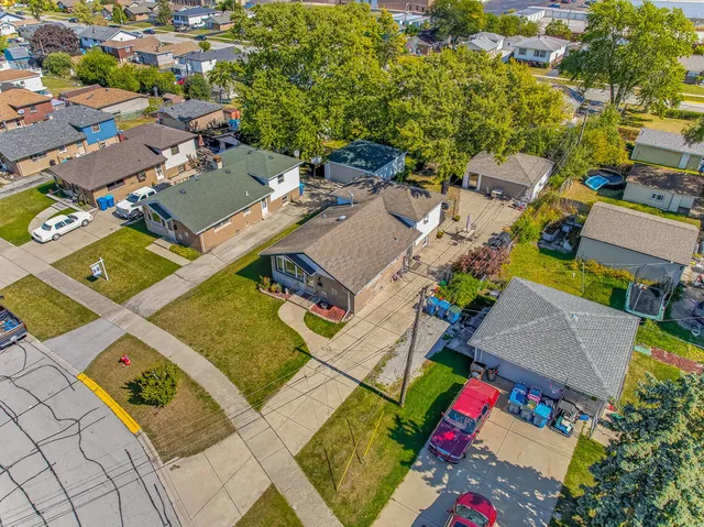an aerial view of a house with a swimming pool