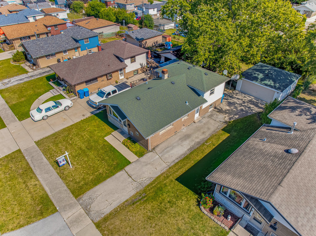 12549 South Tripp Avenue Alsip, IL 60803 - Photo 27 of 30 an aerial view of a house with a garden and swimming pool