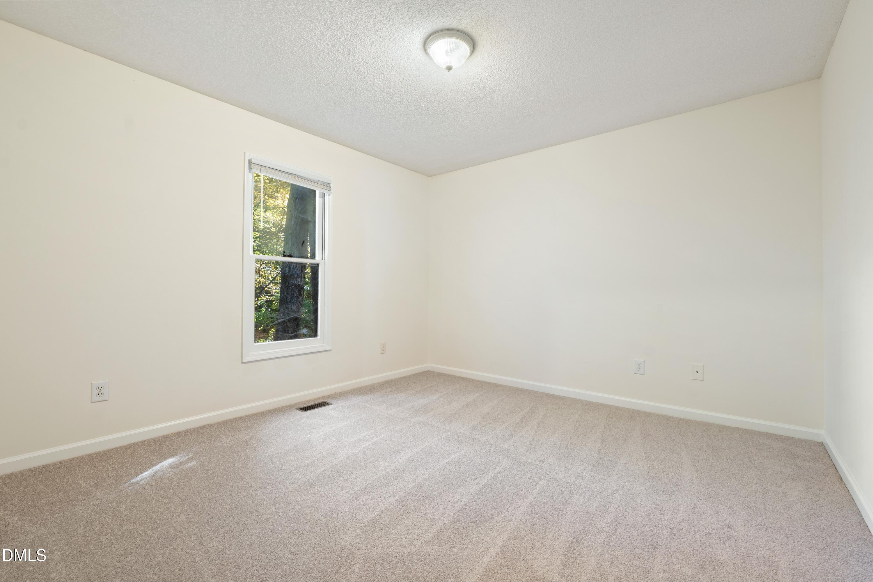 121 Westview Drive, Unit 33 Carrboro, NC 27510 - Photo 7 of 13 an empty room with windows