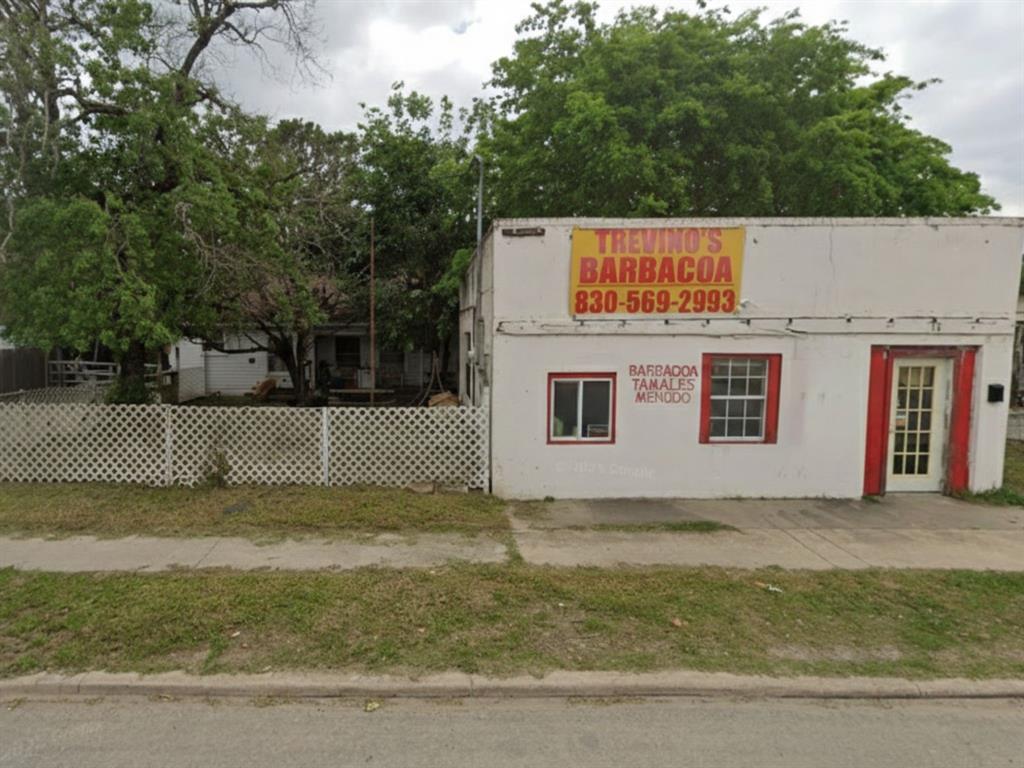 a view of a house with a fence