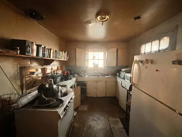 a storage room with cabinets washer and dryer