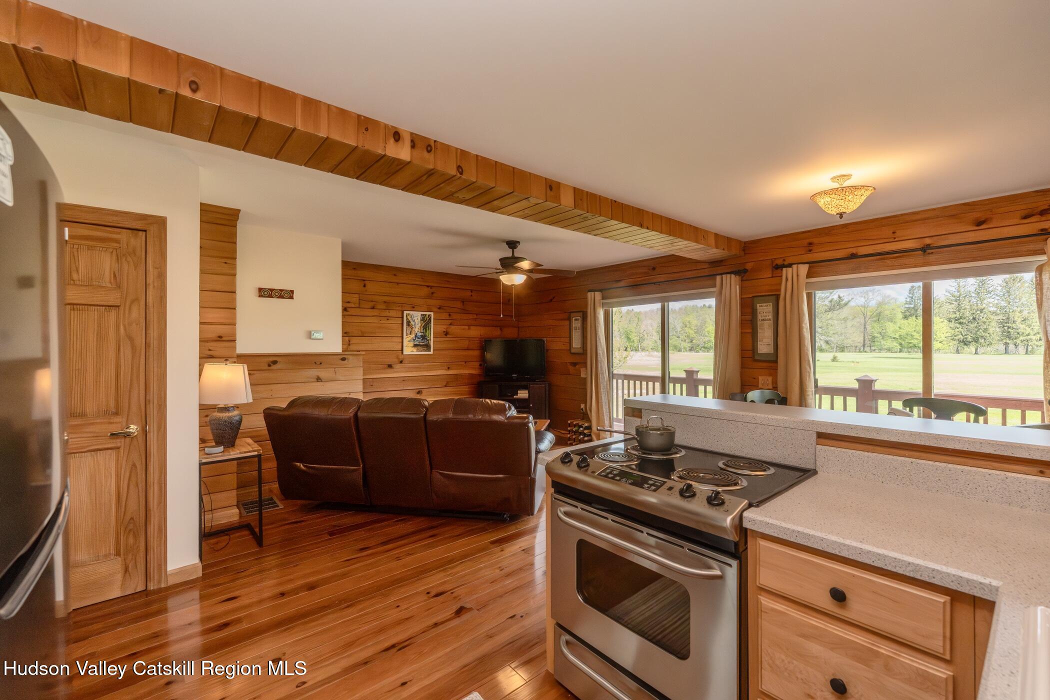 140 Stone Dock Road High Falls, NY 12440 - Photo 13 of 42 a kitchen with stainless steel appliances granite countertop a stove and a refrigerator