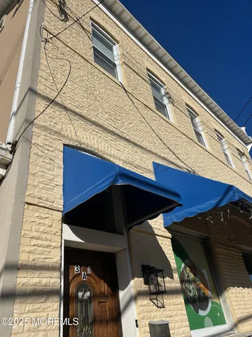 a kitchen with stainless steel appliances a stove a sink and a microwave