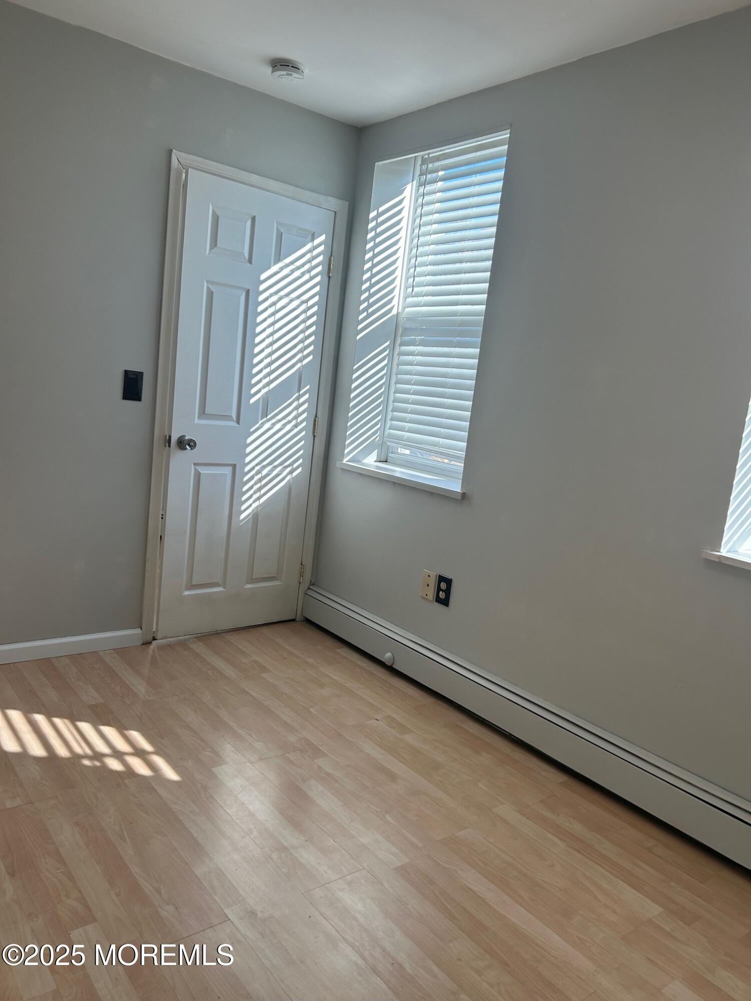 31 Main Street, Unit UPSTAIRS Englishtown, NJ 07726 - Photo 9 of 10 an empty room with windows