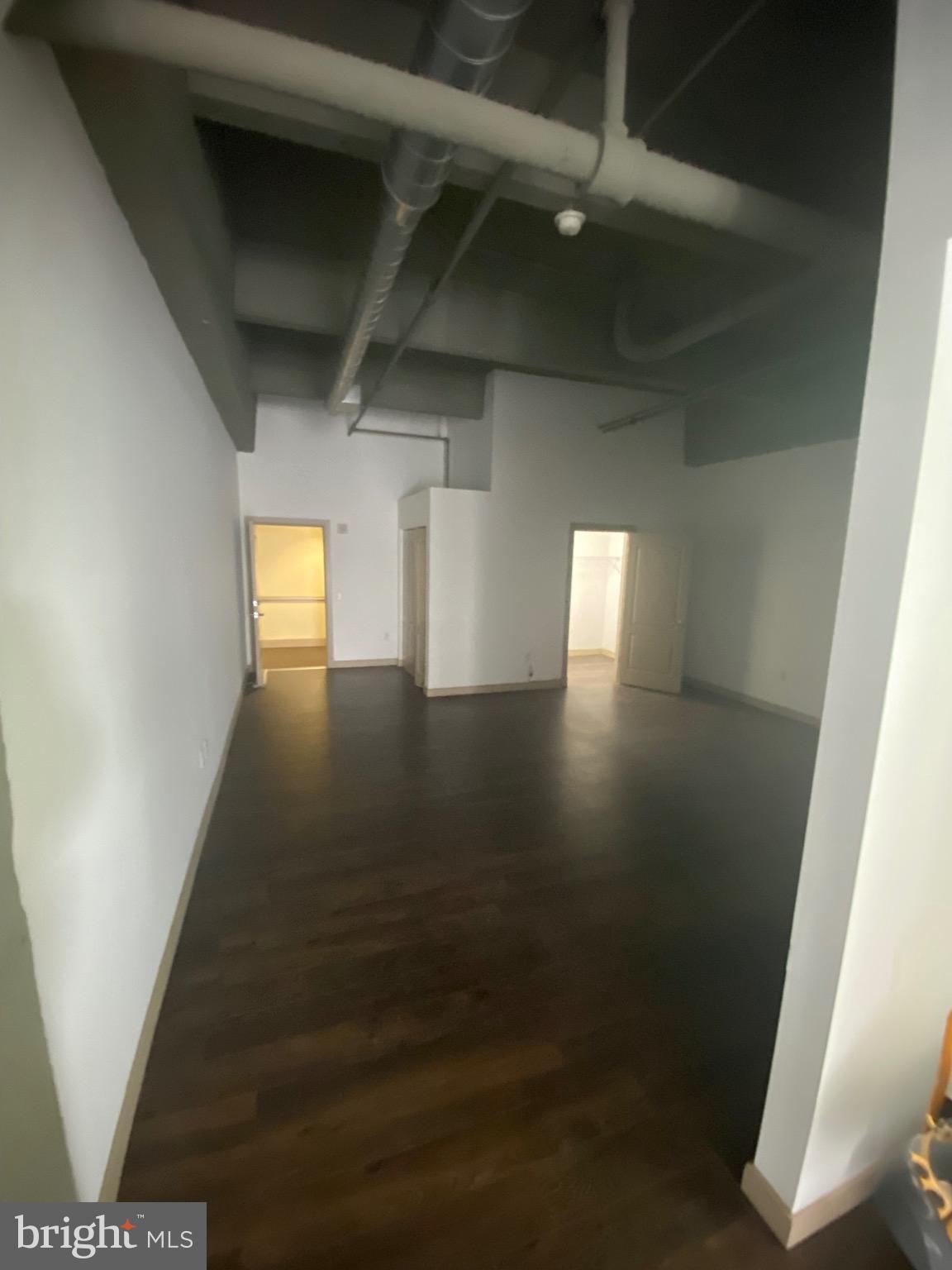 511 North Broad Street, Unit 202 Philadelphia, PA 19123 - Photo 13 of 29 a view of an empty room with wooden floor and a window
