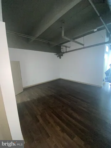 a view of wooden floor in an empty room
