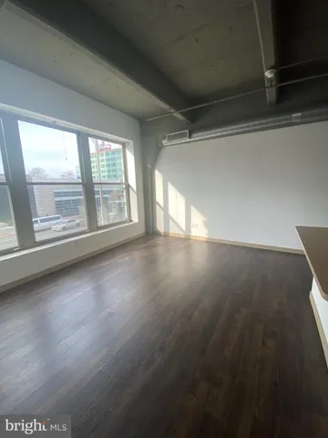 a kitchen with stainless steel appliances a refrigerator and a stove