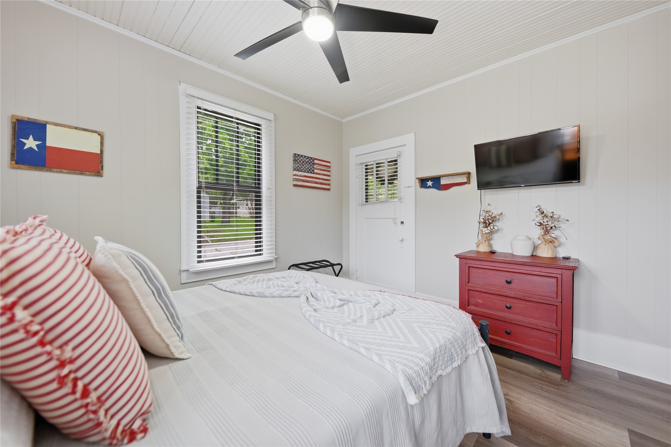 1500 Church Street Brenham, TX 77833 - Photo 13 of 30 a bedroom with a bed and a flat screen tv