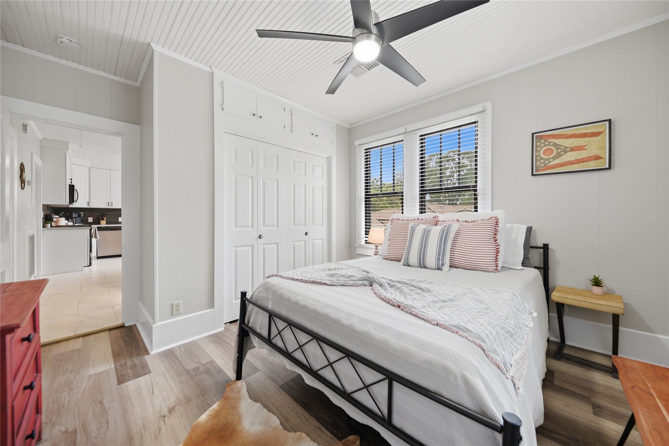 1500 Church Street Brenham, TX 77833 - Photo 14 of 30 a bedroom with a bed and a chandelier