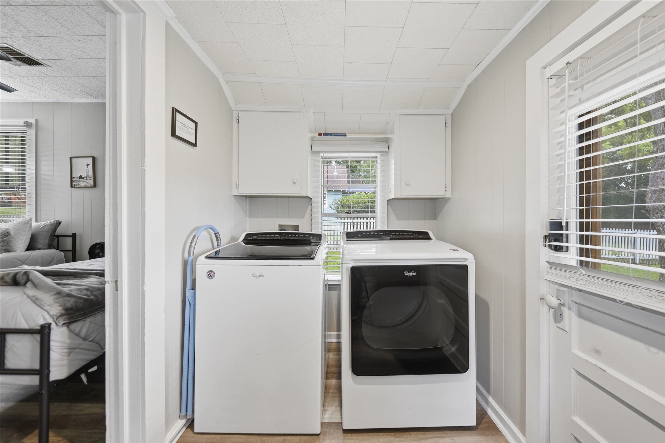 1500 Church Street Brenham, TX 77833 - Photo 20 of 30 a utility room with cabinets washer and dryer