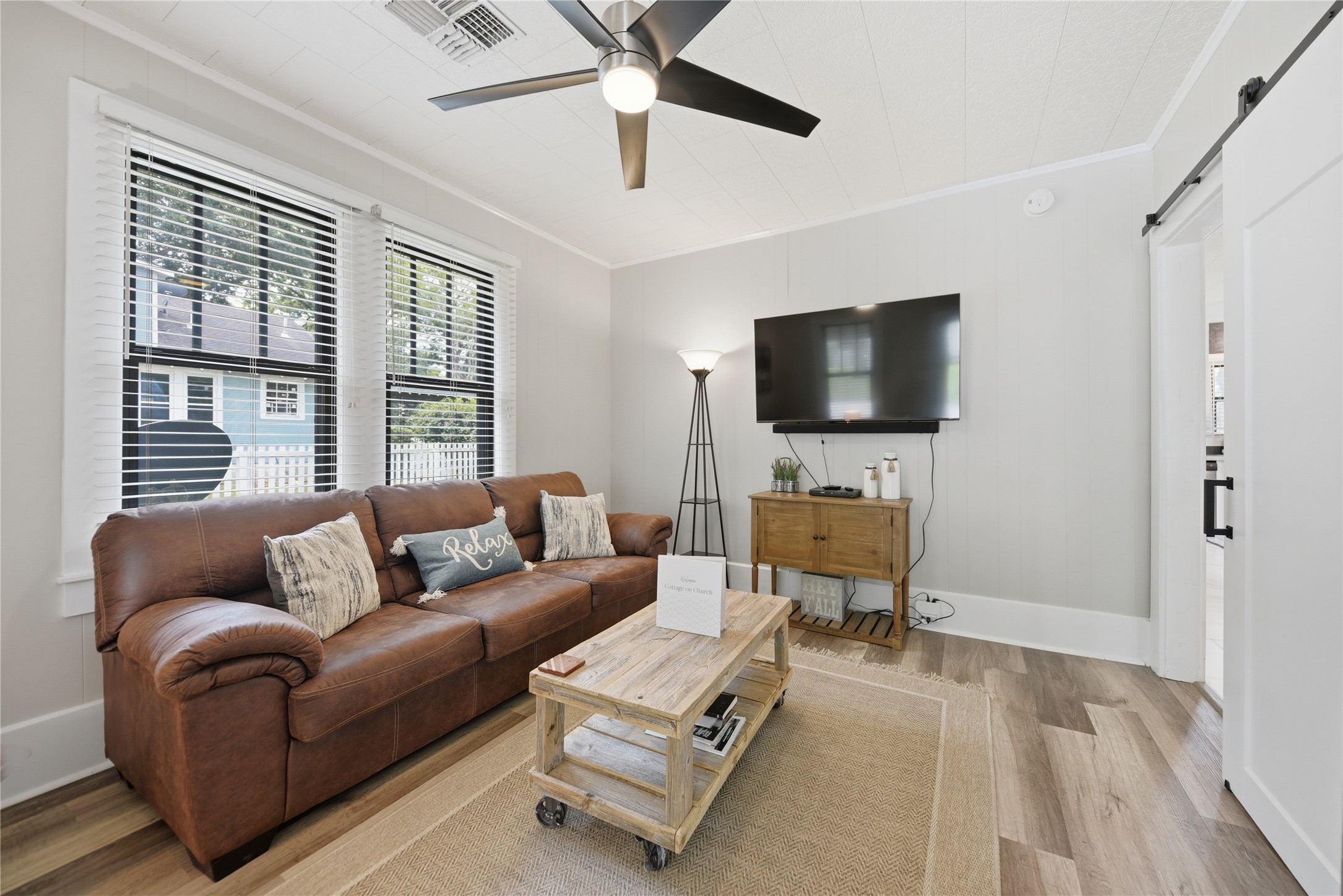 1500 Church Street Brenham, TX 77833 - Photo 7 of 30 a living room with furniture and a flat screen tv