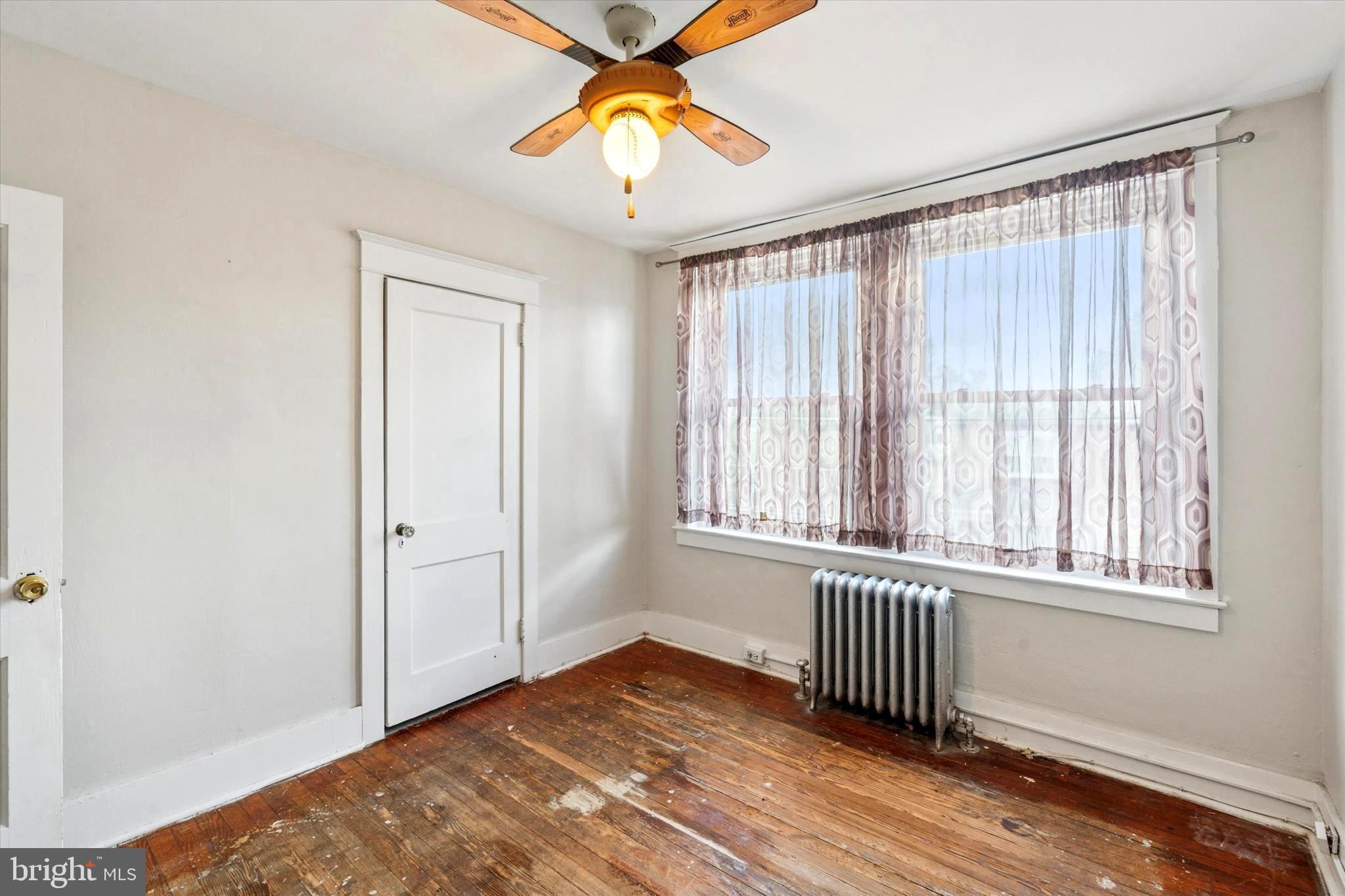 124 Arnold Road Ardmore, PA 19003 - Photo 14 of 24 an empty room with a window and wooden floor