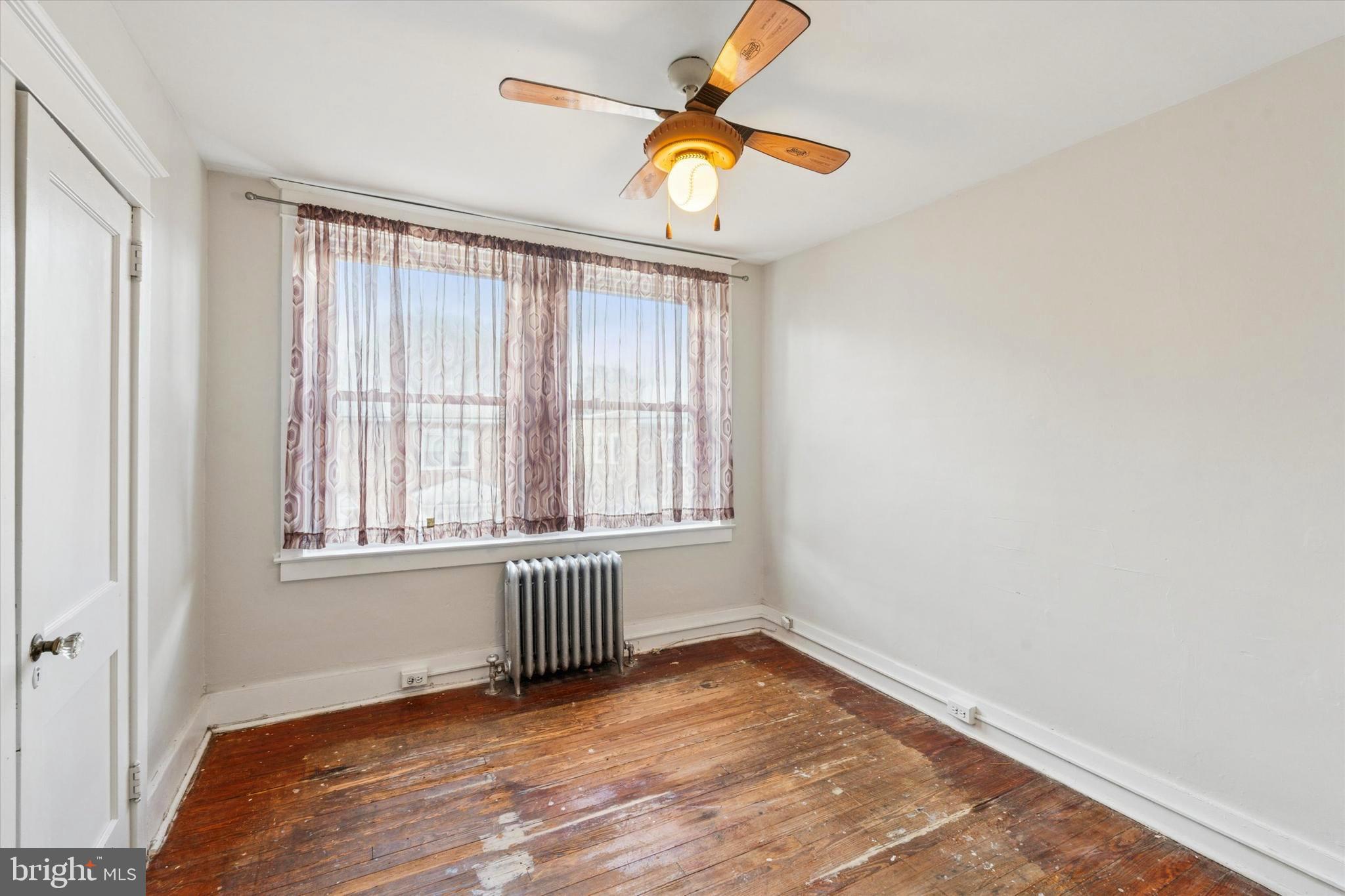 124 Arnold Road Ardmore, PA 19003 - Photo 15 of 24 an empty room with a window and a ceiling fan