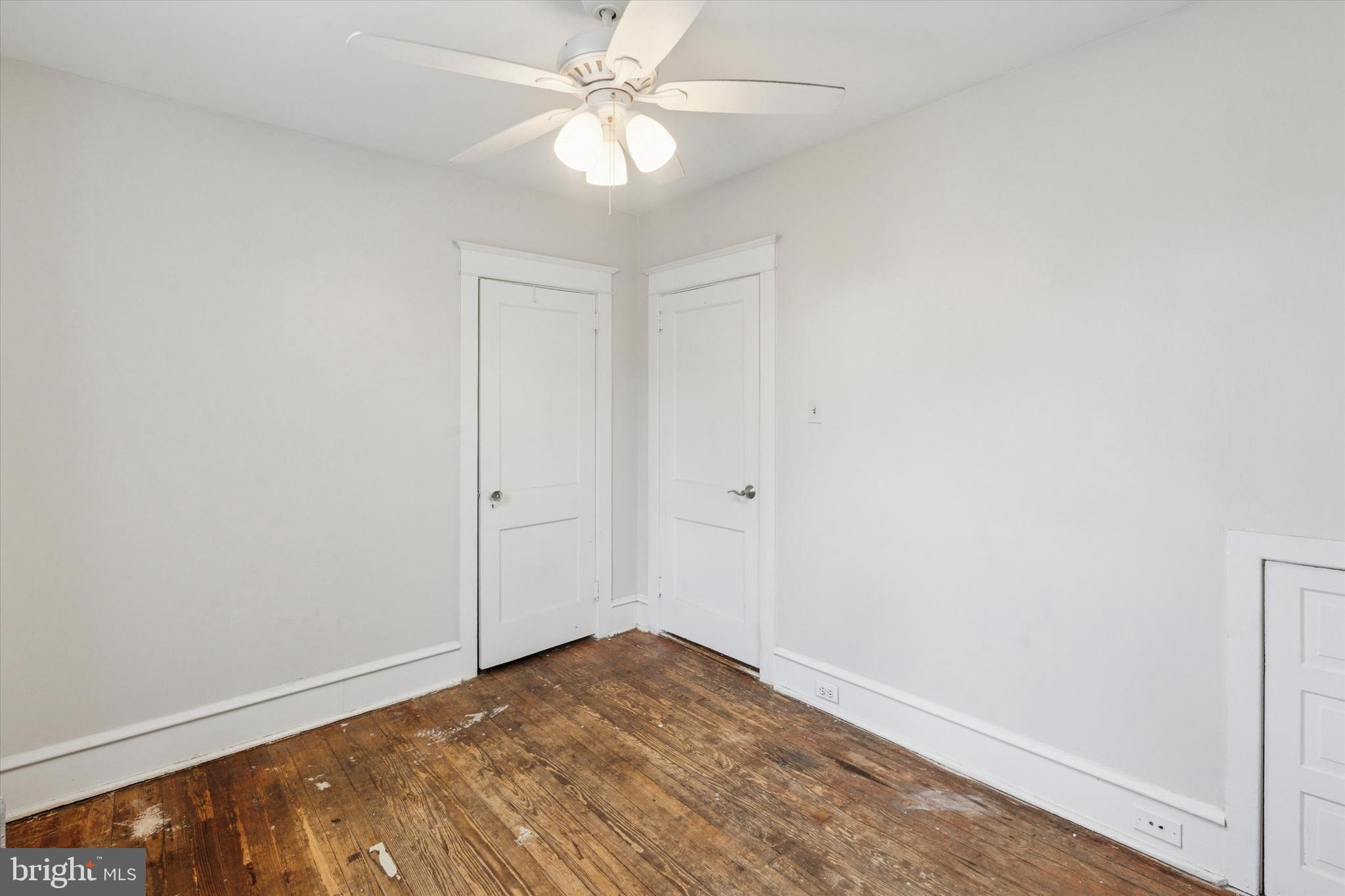 124 Arnold Road Ardmore, PA 19003 - Photo 19 of 24 an empty room with a ceiling fan and carpet
