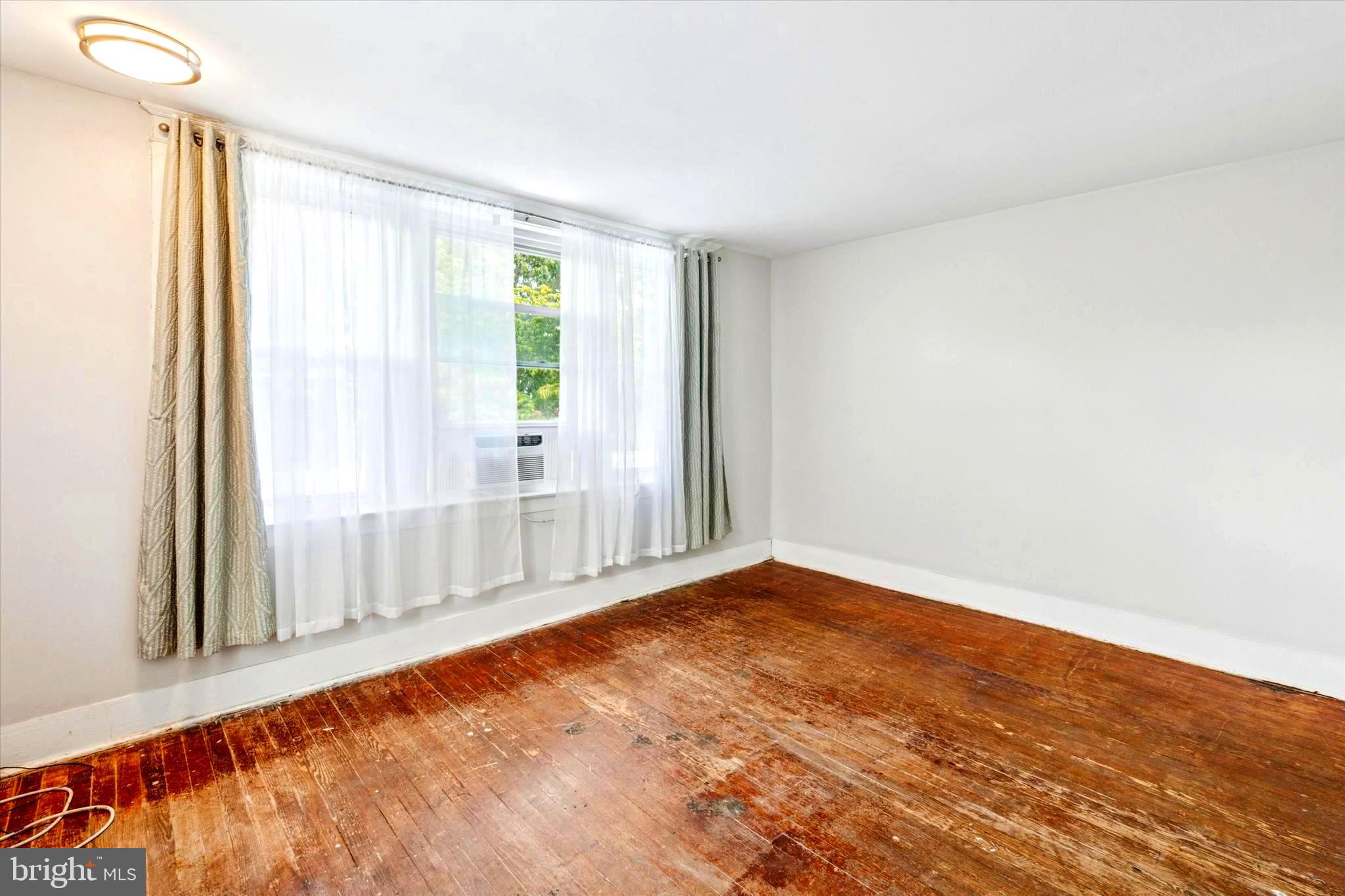 124 Arnold Road Ardmore, PA 19003 - Photo 20 of 24 a view of an empty room with a window