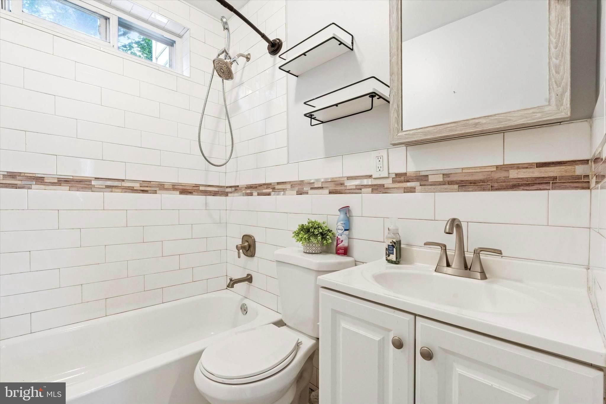 124 Arnold Road Ardmore, PA 19003 - Photo 22 of 24 a bathroom with a sink a toilet and shower