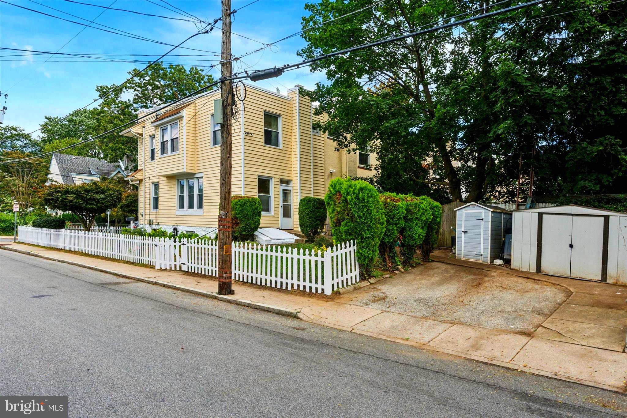 124 Arnold Road Ardmore, PA 19003 - Photo 3 of 24 a front view of a house with a garden