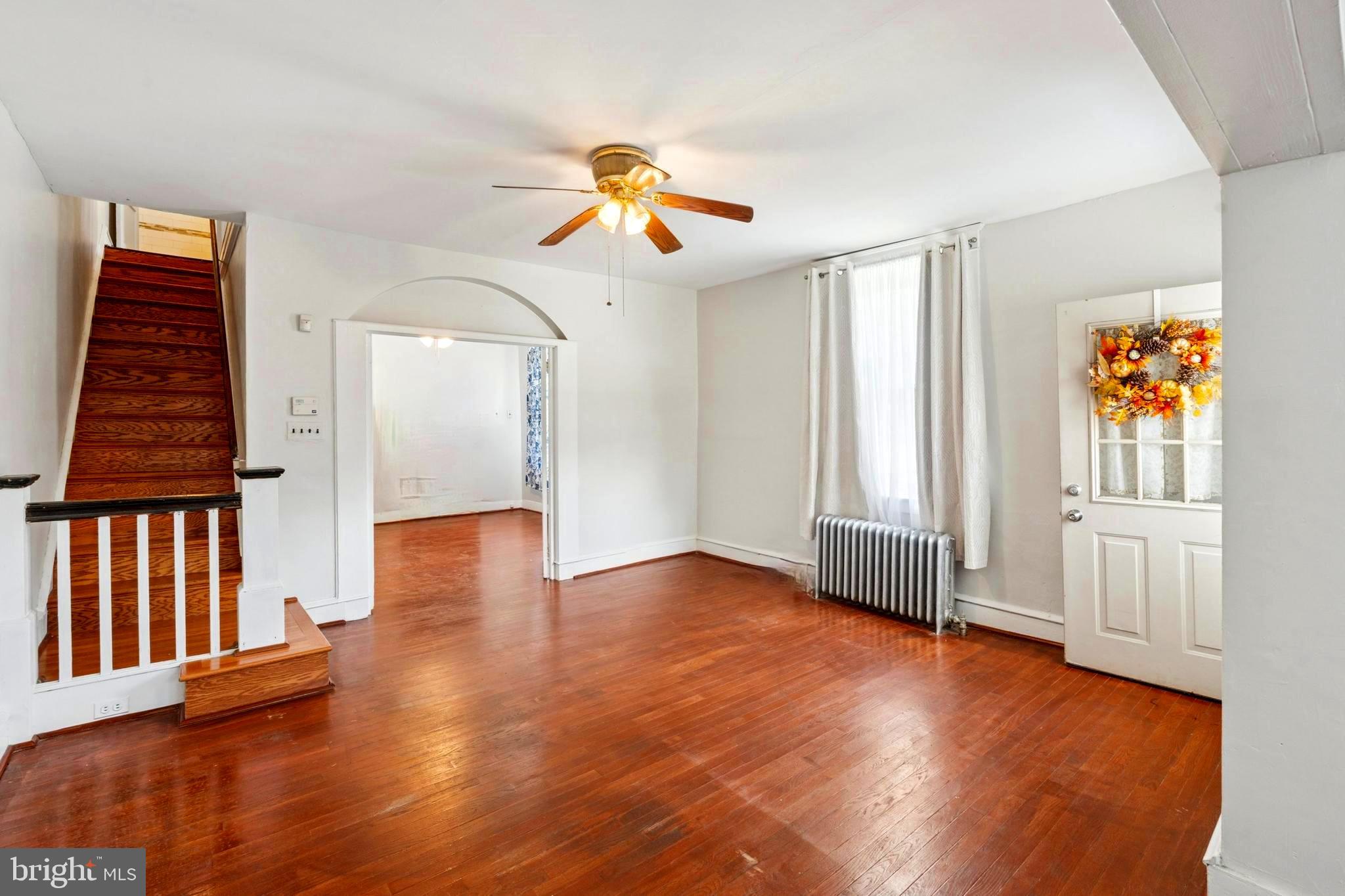 124 Arnold Road Ardmore, PA 19003 - Photo 4 of 24 wooden floor in an empty room with a window