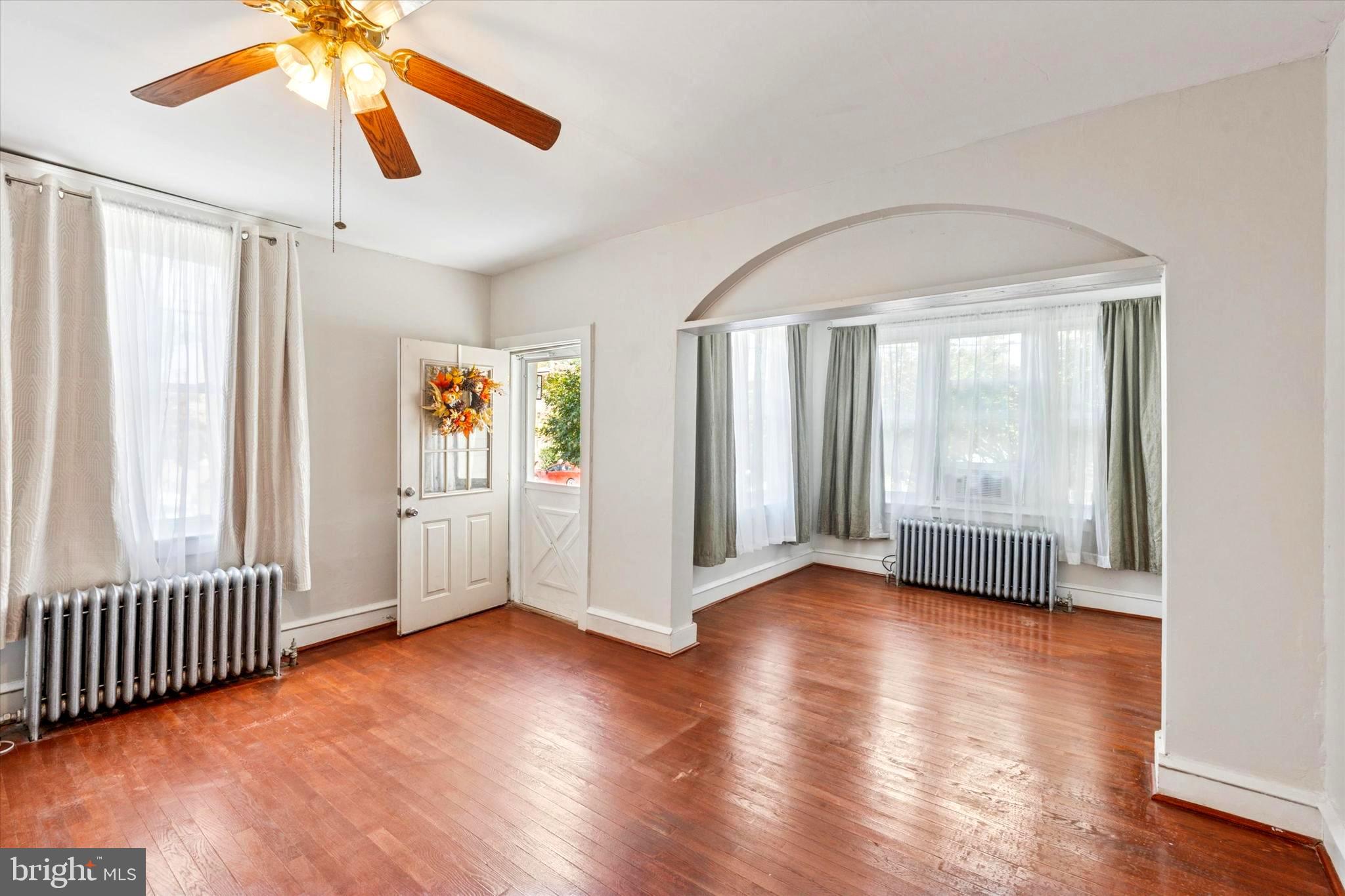 124 Arnold Road Ardmore, PA 19003 - Photo 6 of 24 wooden floor in an empty room with a window