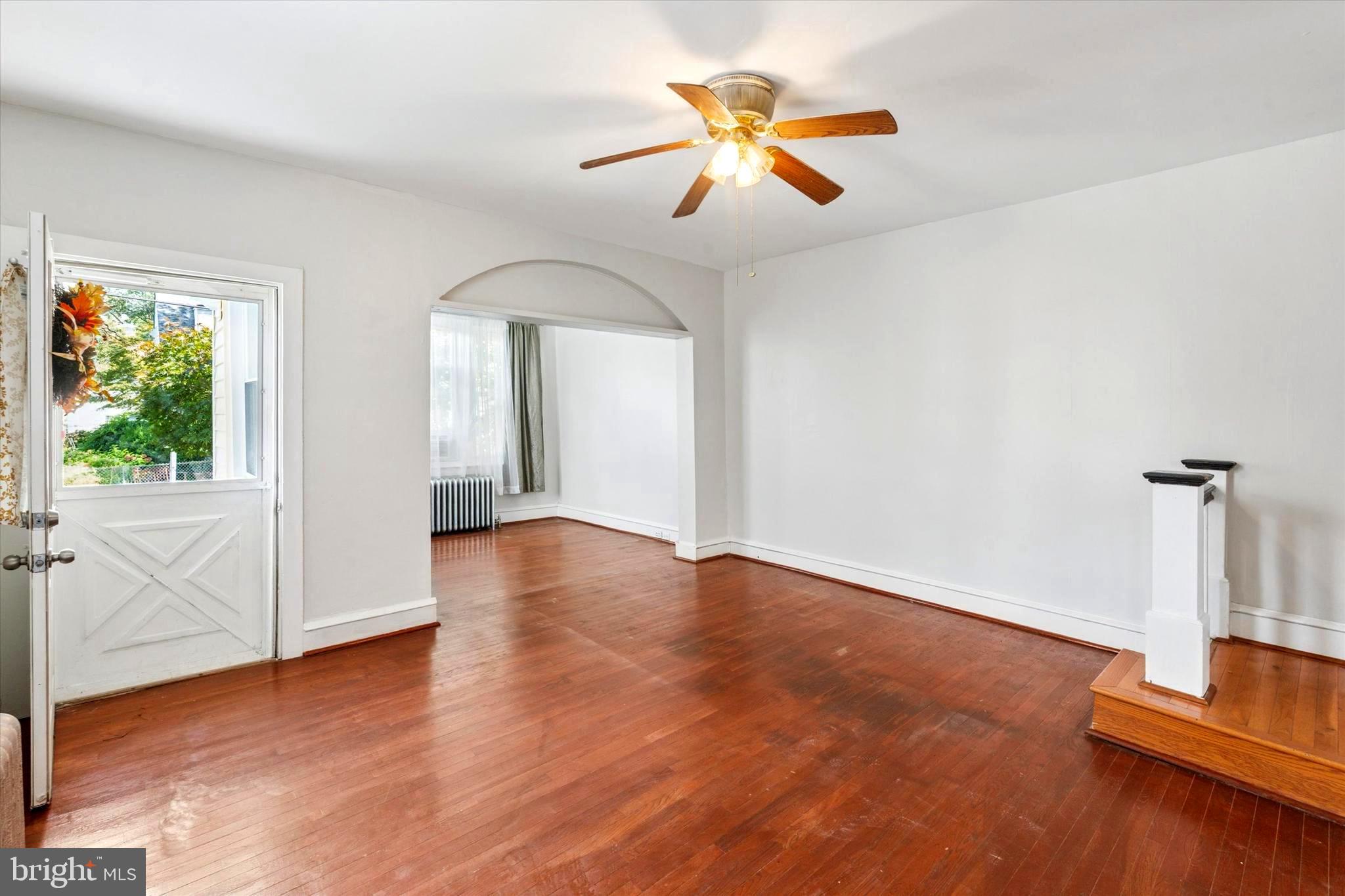 124 Arnold Road Ardmore, PA 19003 - Photo 7 of 24 wooden floor in an empty room with a window