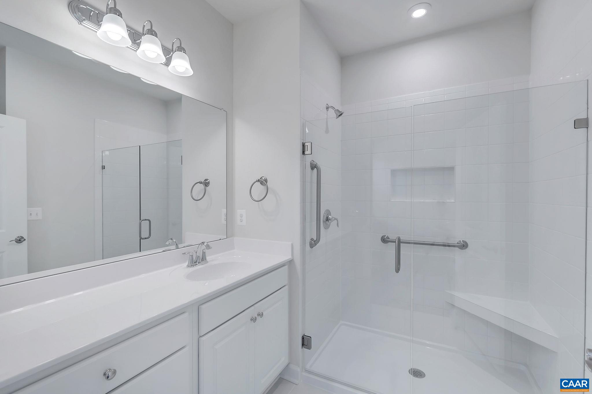 106 Cliffstone Boulevard Charlottesville, VA 22911 - Photo 11 of 29 a bathroom with a shower sink large mirror and vanity