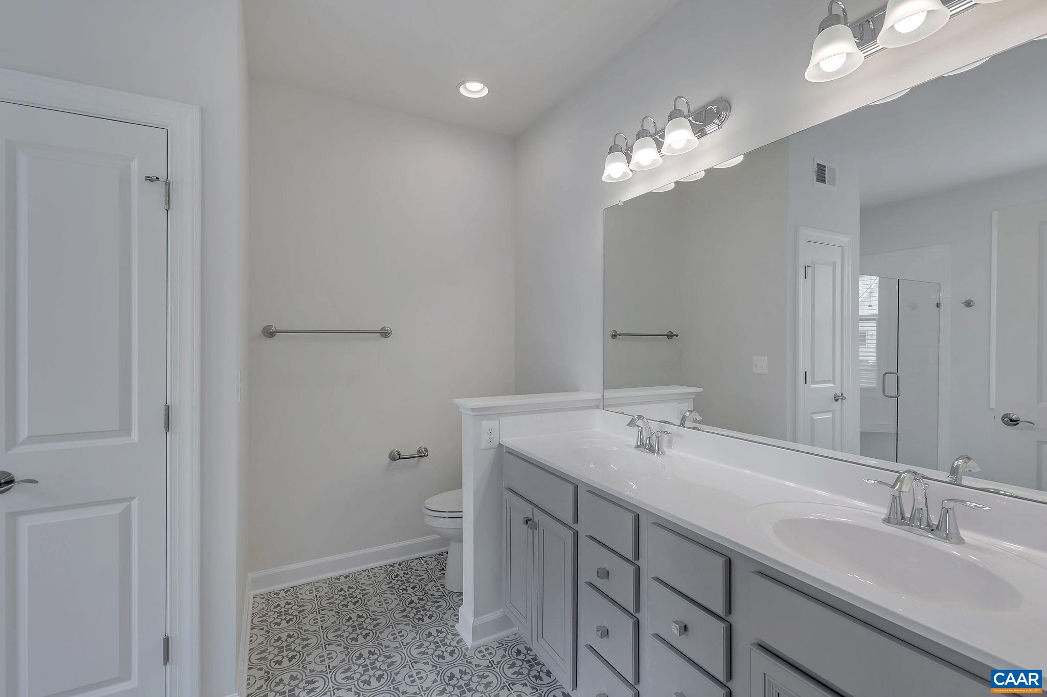 106 Cliffstone Boulevard Charlottesville, VA 22911 - Photo 14 of 29 a bathroom with a sink a light fixture and a mirror