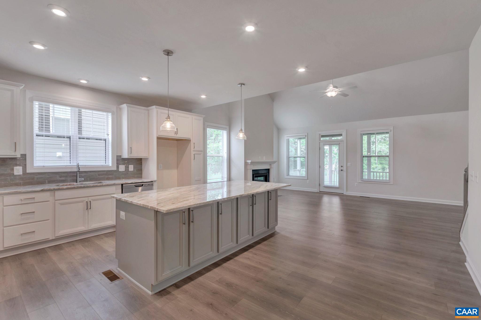 106 Cliffstone Boulevard Charlottesville, VA 22911 - Photo 4 of 29 a large kitchen with stainless steel appliances granite countertop a large center island attached withe living room