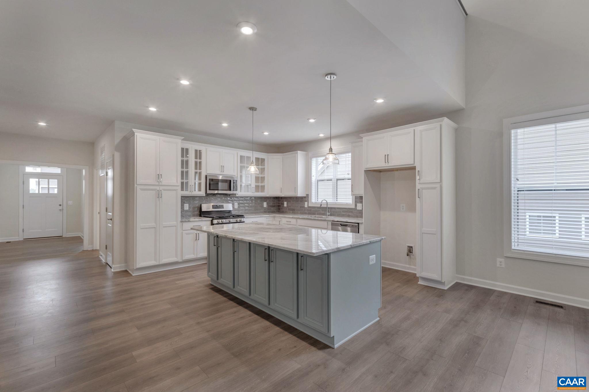 106 Cliffstone Boulevard Charlottesville, VA 22911 - Photo 6 of 29 a kitchen with stainless steel appliances granite countertop a stove and a refrigerator