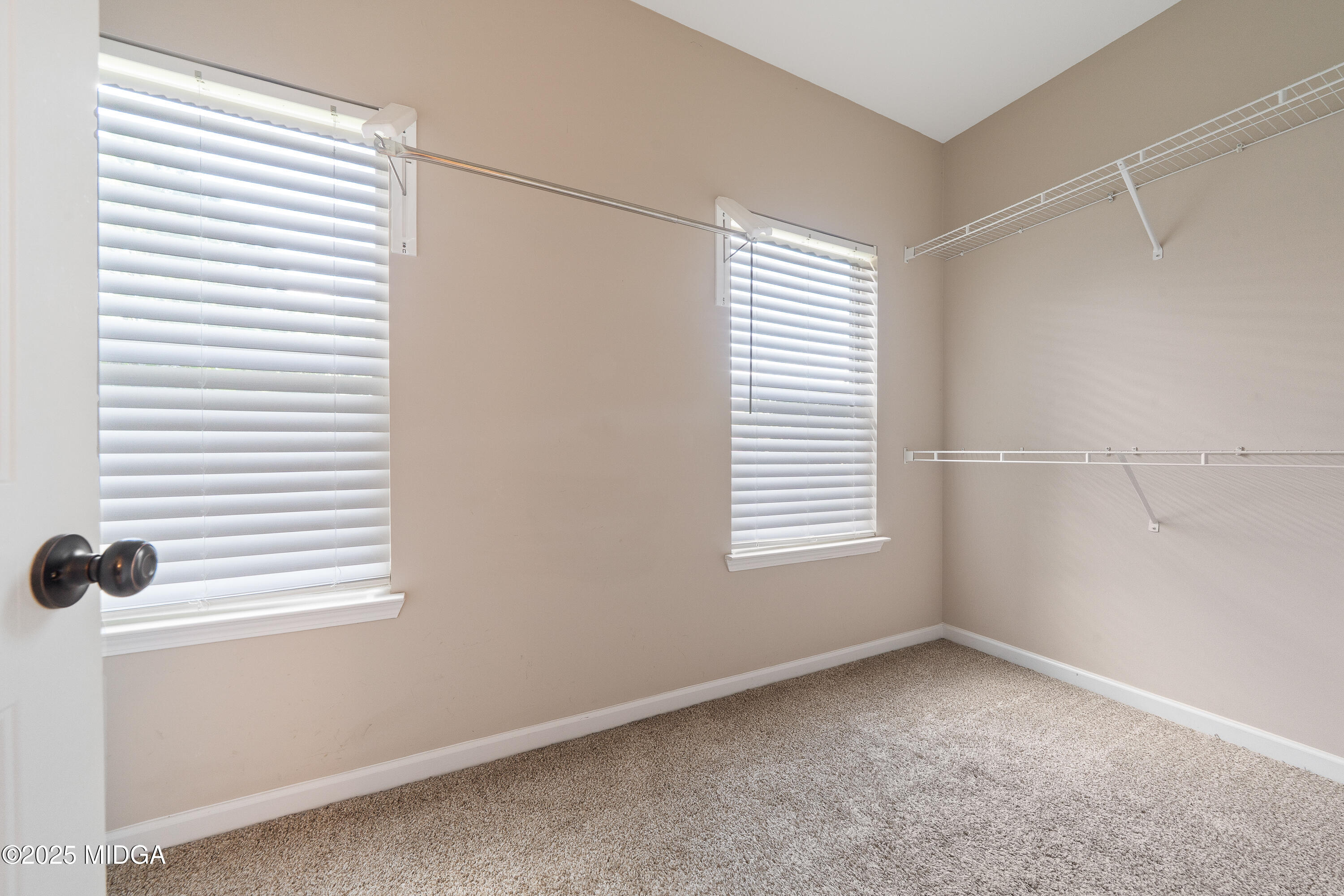 318 Walnut Grove Road Gray, GA 31032 - Photo 27 of 39 a view of a small space with a window and a fan