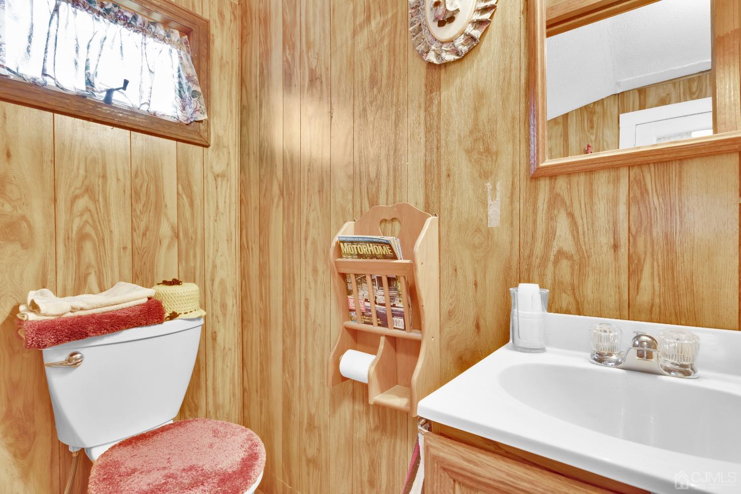 184 Creek Road Keansburg, NJ 07734 - Photo 14 of 29 a bathroom with a sink a toilet and shower curtain
