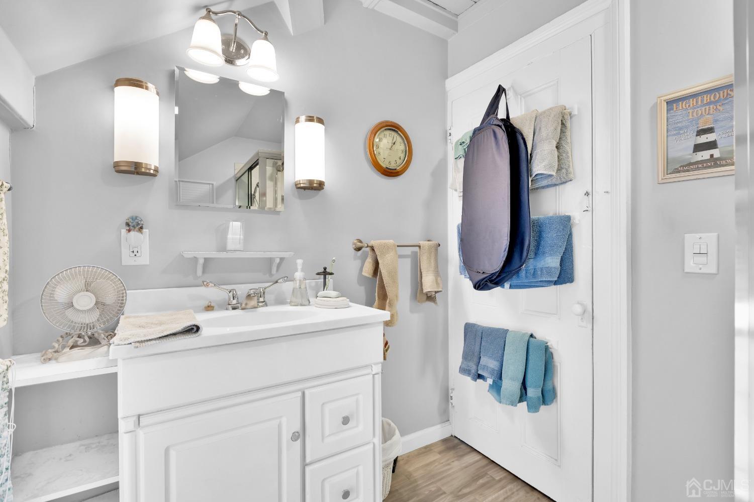 184 Creek Road Keansburg, NJ 07734 - Photo 19 of 29 a bathroom with a double vanity sink and a mirror