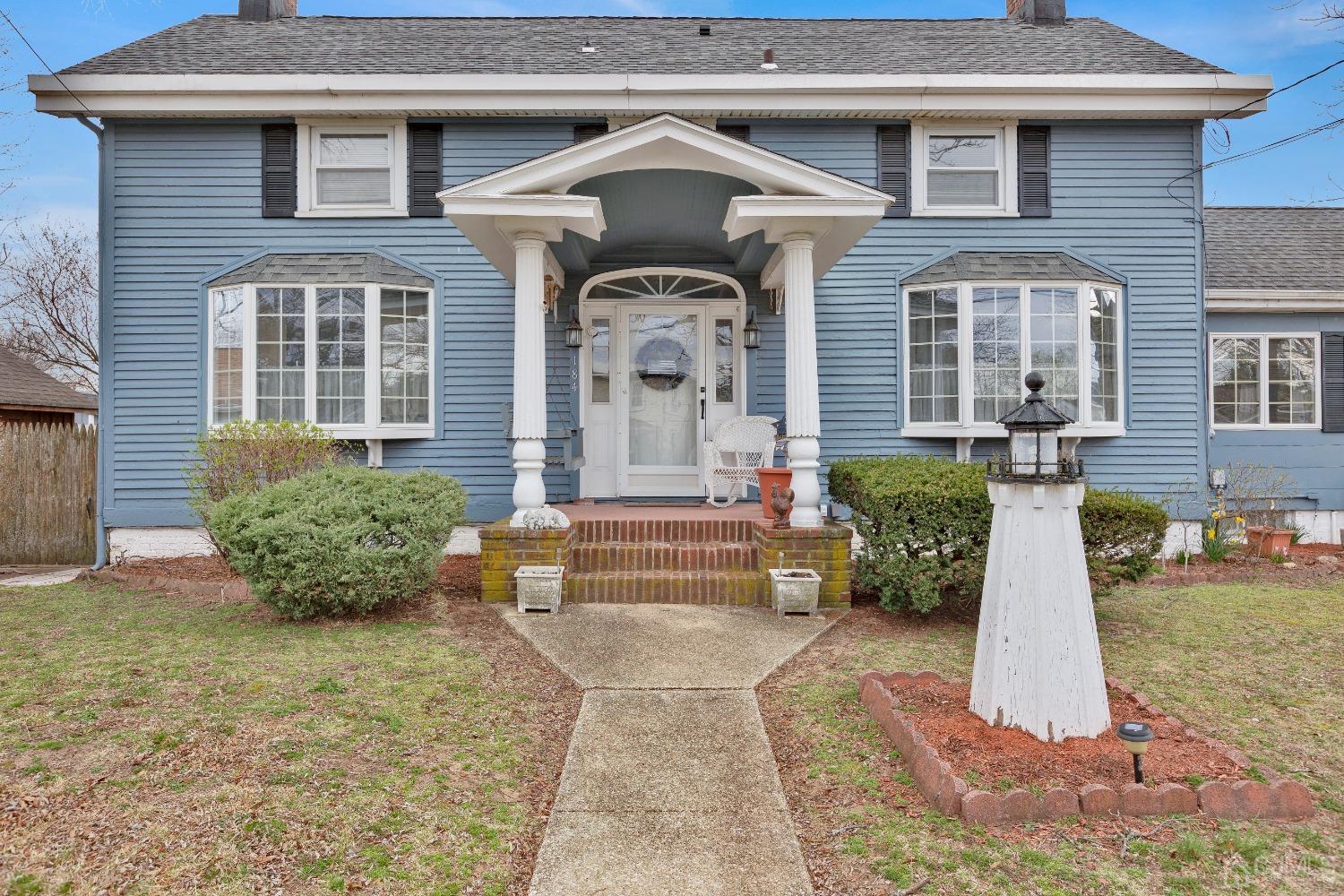 184 Creek Road Keansburg, NJ 07734 - Photo 2 of 29 a front view of a house with garden