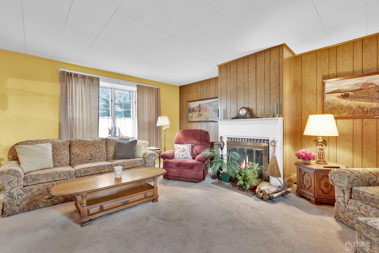 184 Creek Road Keansburg, NJ 07734 - Photo 5 of 29 a living room with furniture fireplace and a window