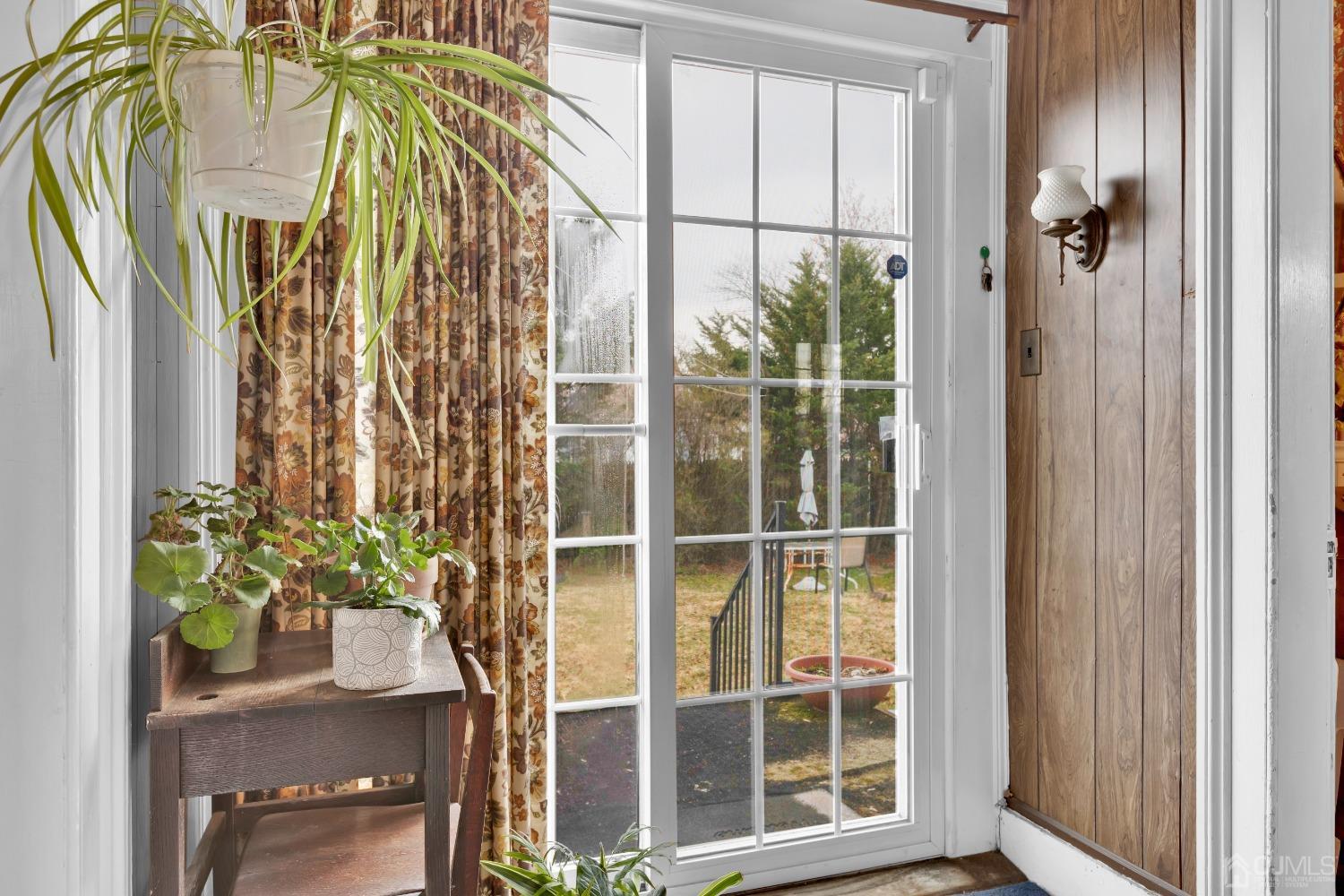 184 Creek Road Keansburg, NJ 07734 - Photo 6 of 29 a view of a potted plant with a window